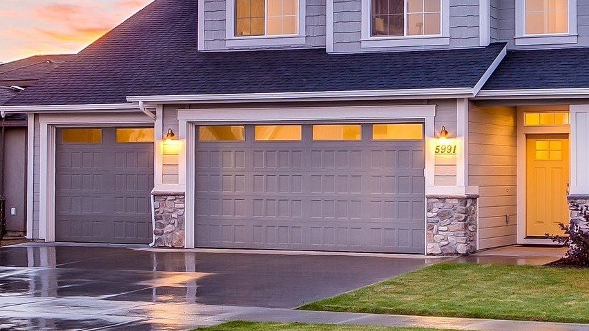 Eco-friendly insulated garage door on a sustainable home with energy-efficient features.