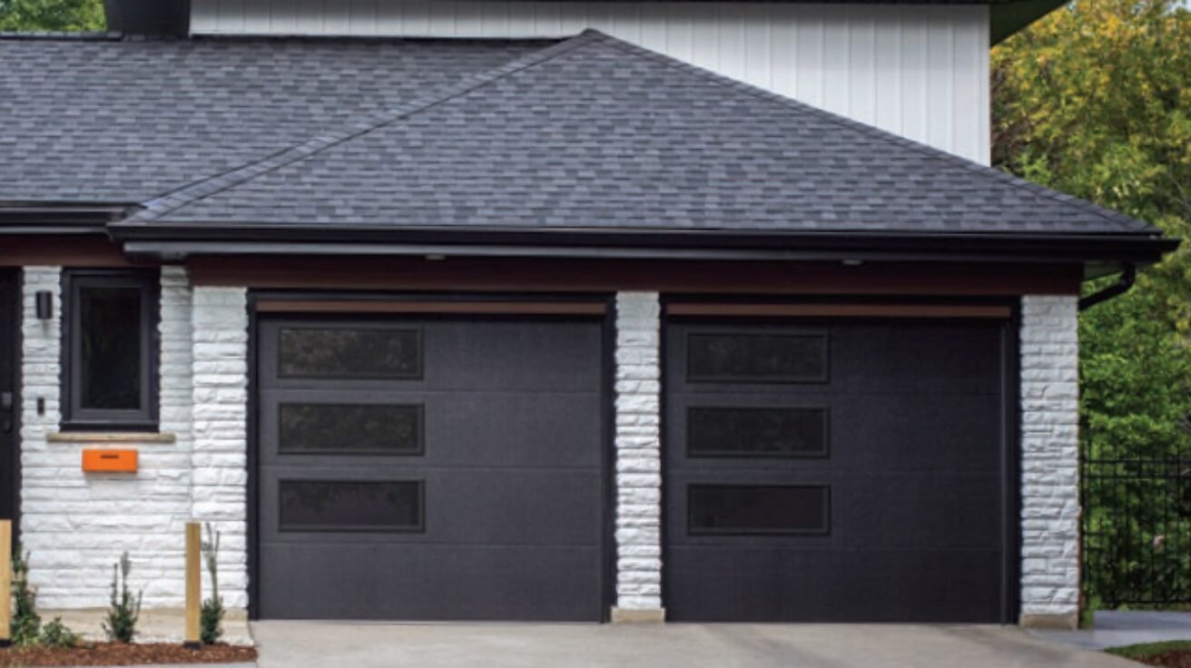 Modern garage door on a stylish home in The Woodlands, TX, showcasing enhanced curb appeal and sleek design.