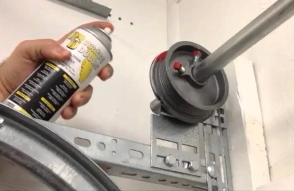 professional lubricating garage door spring in the woodland 